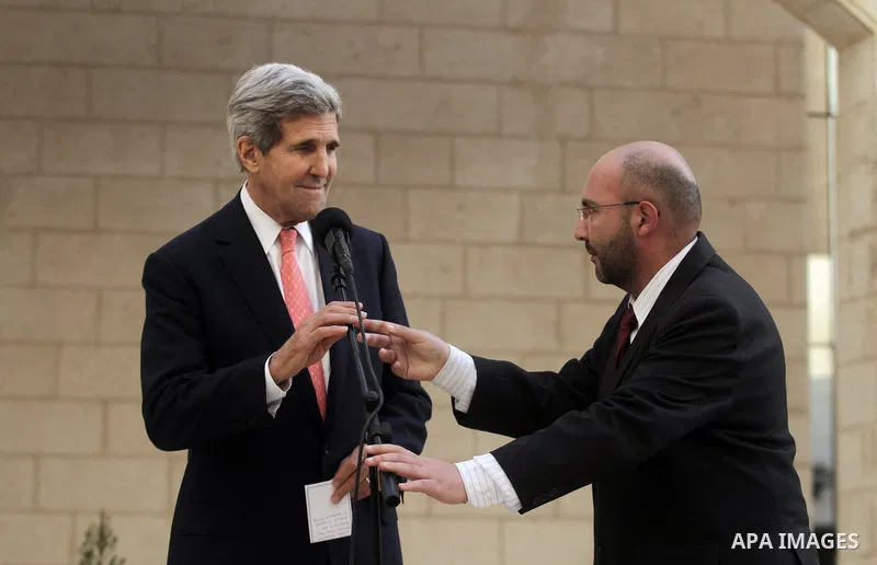 US Secretary of State John Kerry speaks to the media after his meeting with the Palestinian President Mahmoud Abbas during a visit to the West Bank city of Bethlehem, 06 November 2013. Kerry began a day of meetings in Je...