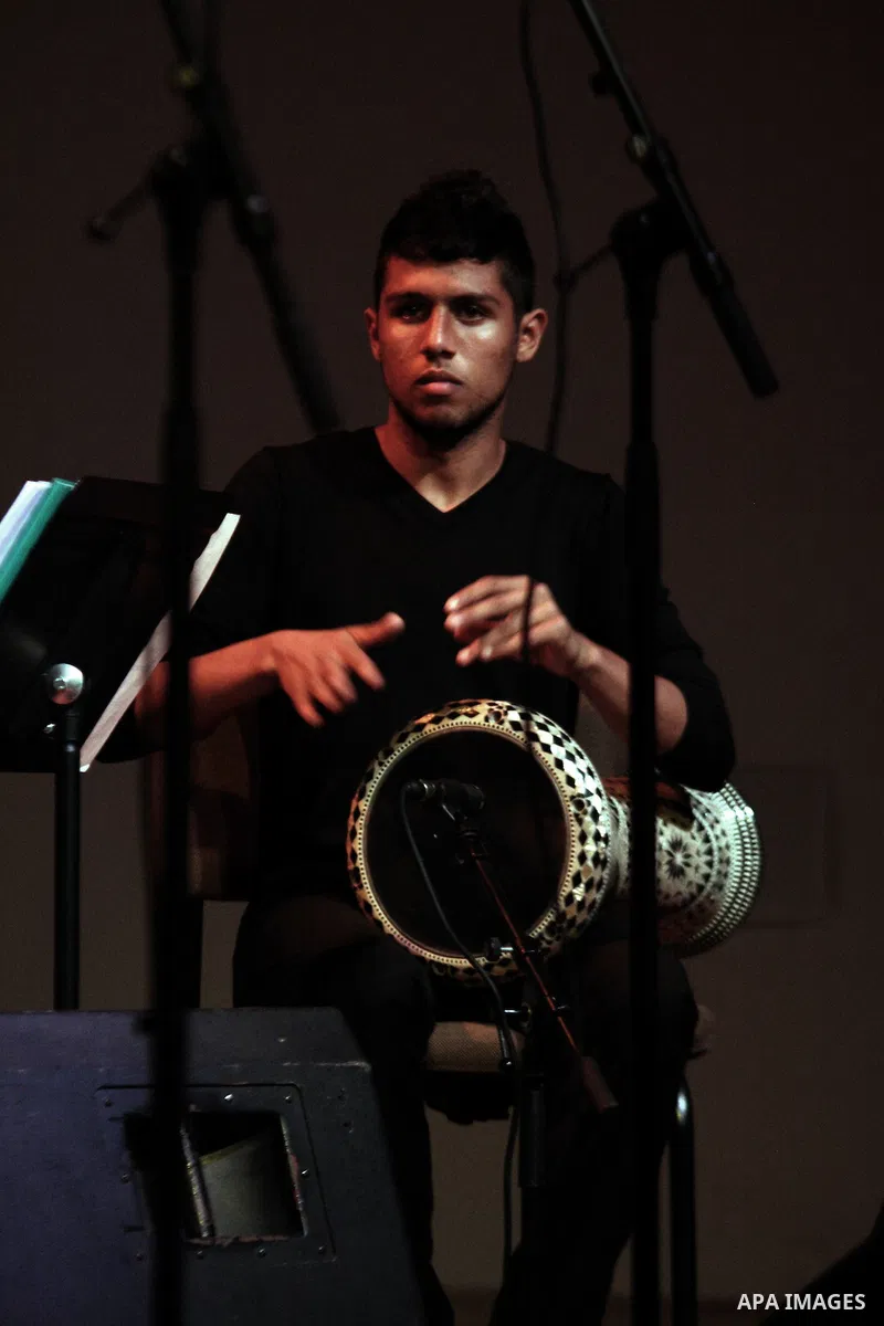 A Palestinian member of "Maqamat-al-Quds" musical band performs during the Opening of "Music nights in Jerusalem of Arab" festival, in Jerusalem on November 07, 2013. The festival organised by Edward Said music conservat...
