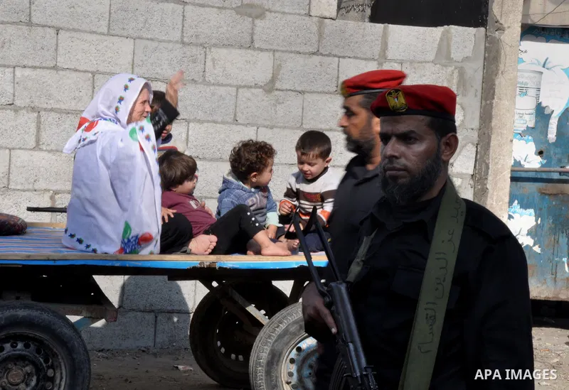Members of the Palestinian security forces march along the streets in Gaza City on November 13, 2013, ahead of the first anniversary an Israeli army operation which was launched after the killing of top Palestinian milit...