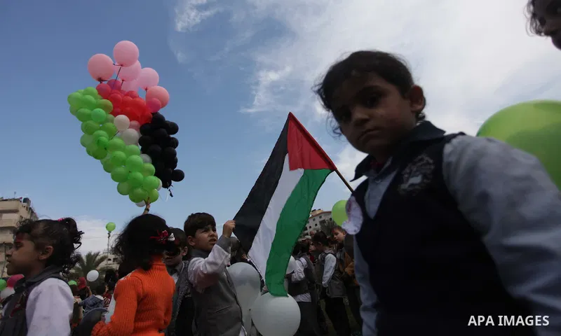 Palestinians hold balloons in the colour of the national flag to mark the 25th anniversary of the Palestinian Independence Day, in Gaza city, on Nov. 17, 2013. Palestinians have marked Nov. 15 as their Independence Day s...