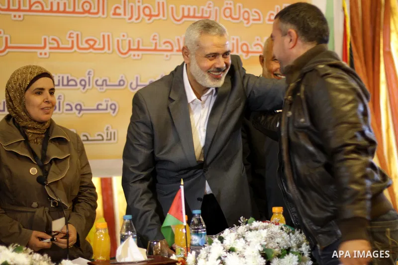 Palestinian Prime Minister in Gaza Strip Ismail Haniyeh, speaks during a meeting with Syrian and Palestinian-Syrian refugees in Gaza City on November 17, 2013. Photo by Mohammed Asad