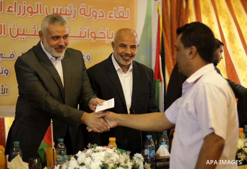 Palestinian Prime Minister in Gaza Strip Ismail Haniyeh, speaks during a meeting with Syrian and Palestinian-Syrian refugees in Gaza City on November 17, 2013. Photo by Mohammed Asad