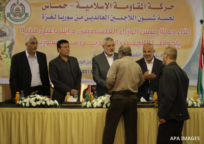 Palestinian Prime Minister in Gaza Strip Ismail Haniyeh, speaks during a meeting with Syrian and Palestinian-Syrian refugees in Gaza City on November 17, 2013. Photo by Mohammed Asad