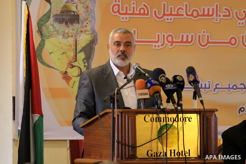 Palestinian Prime Minister in Gaza Strip Ismail Haniyeh, speaks during a meeting with Syrian and Palestinian-Syrian refugees in Gaza City on November 17, 2013. Photo by Mohammed Asad