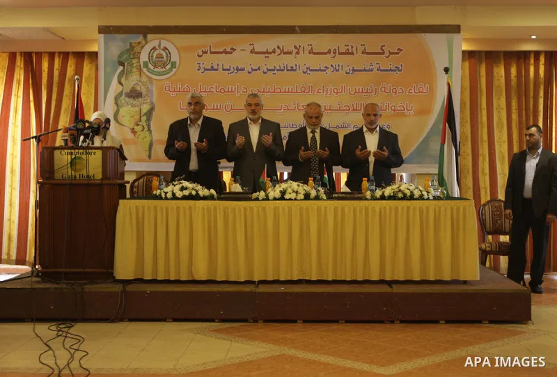 Palestinian Prime Minister in Gaza Strip Ismail Haniyeh, speaks during a meeting with Syrian and Palestinian-Syrian refugees in Gaza City on November 17, 2013. Photo by Mohammed Asad