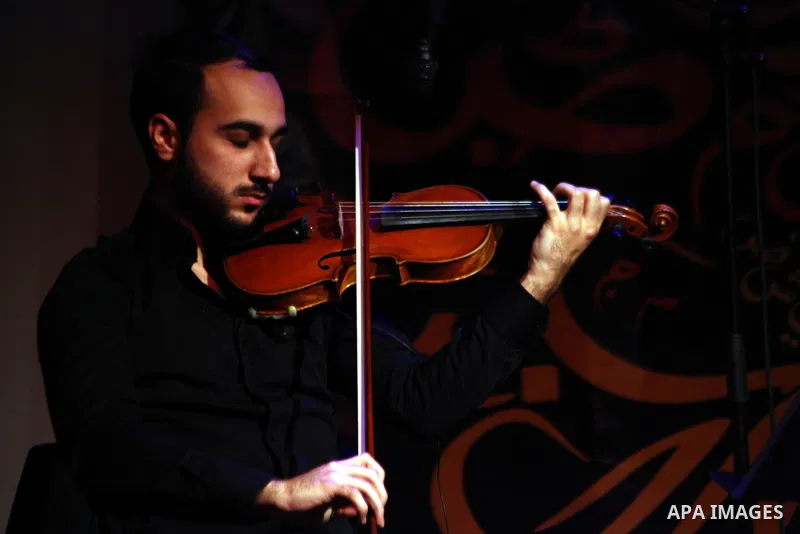 A member of "Ramses Qisses" musical band performs during the fifth concert of "Music nights in Jerusalem of Arab" festival, in Jerusalem on November 17, 2013. The festival organised by Edward Said music conservatory for...
