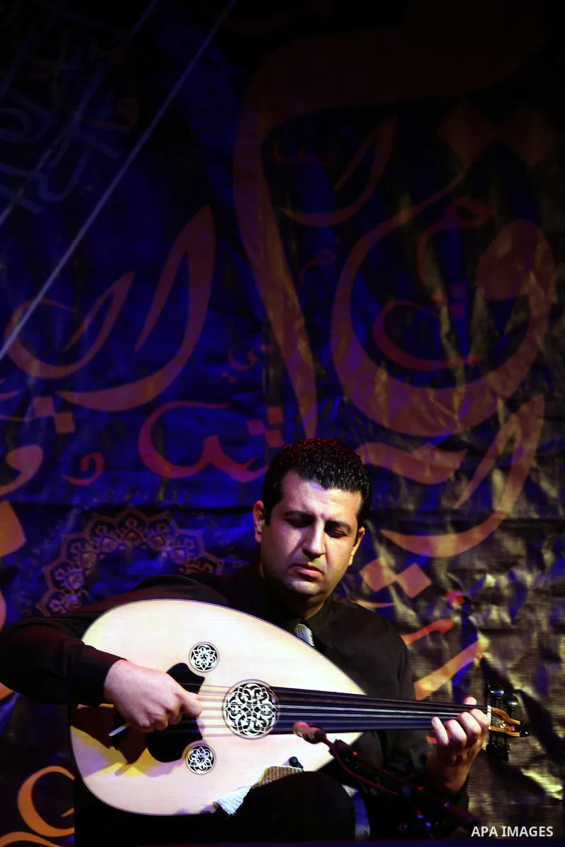 A member of "Ramses Qisses" musical band performs during the fifth concert of "Music nights in Jerusalem of Arab" festival, in Jerusalem on November 17, 2013. The festival organised by Edward Said music conservatory for...