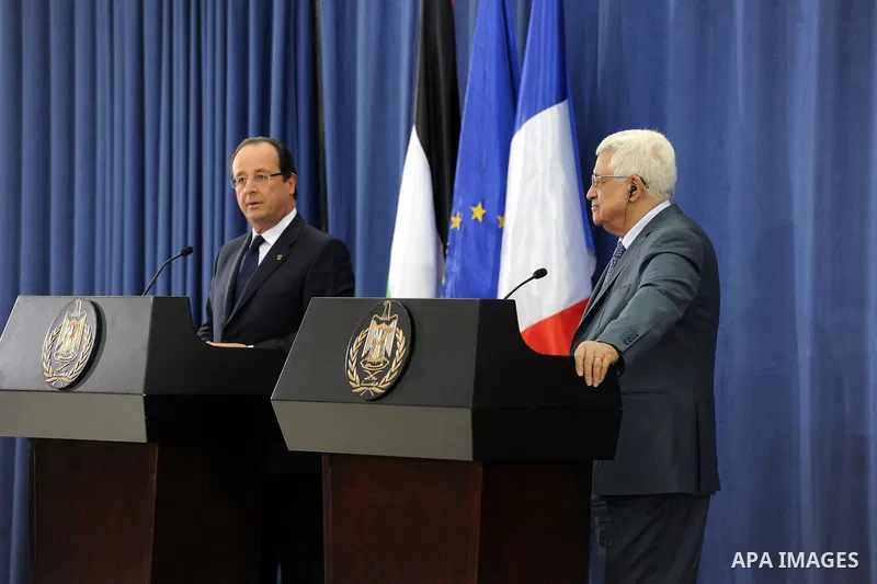 Palestinian President Mahmoud Abbas joins French President Francois Hollande in a press conference , in the West Bank city of Ramallah, on November 18, 2013. Hollande is expected to meet with Palestinian leaders for talk...