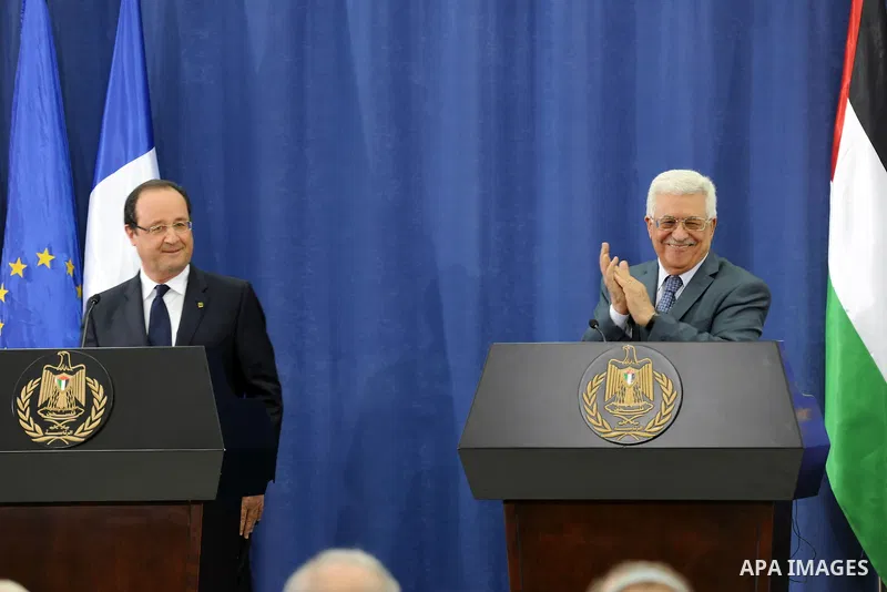 Palestinian President Mahmoud Abbas joins French President Francois Hollande in a press conference , in the West Bank city of Ramallah, on November 18, 2013. Hollande is expected to meet with Palestinian leaders for talk...