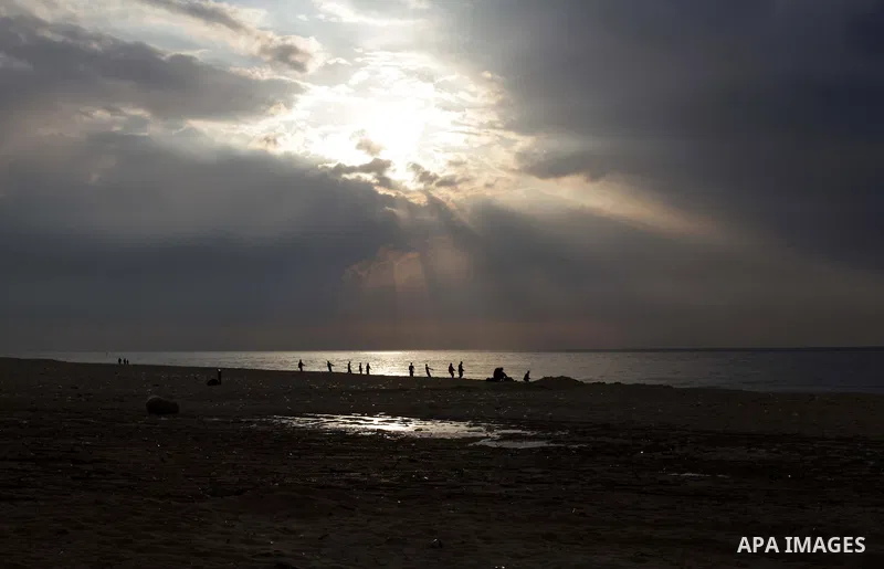 Palestinian fishermen retrieve their net during a rainy day at the beach of Gaza City, on November 18, 2013. Photo by Ashraf Amra