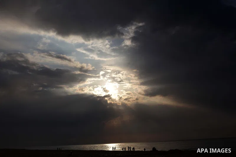 Palestinian fishermen retrieve their net during a rainy day at the beach of Gaza City, on November 18, 2013. Photo by Ashraf Amra