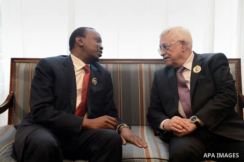 Palestinian President Mahmoud Abbas meets with the President of the Republic of Kenya Uhuru Kenyatta during the Arab and African leaders summit in Kuwait City on November 19, 2013. The two-day summit that starts Tuesday...