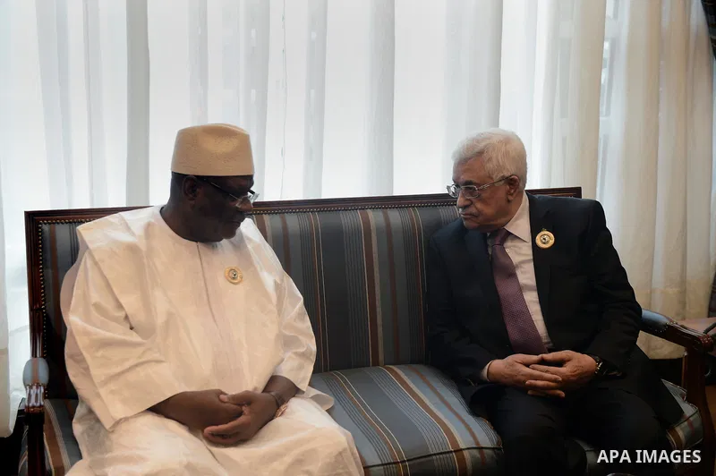 Palestinian President Mahmoud Abbas meets with the President of the Islamic Republic of Mali Ibrahim Boubacar Keïta during the Arab and African leaders summit in Kuwait City on November 19, 2013. The two-day summit that...