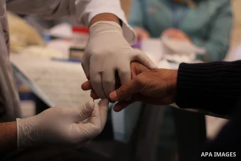 Palestinian youth donates blood during the launch of campaign " the good gathered" in the West Bank city of Ramallah on Nov. 23, 2013. Photo by Issam Rimawi