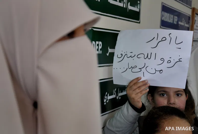 Palestinian students take part a protest against the Israeli blockade on the Gaza Strip, at al-Rantisi hospital, in Gaza city, on Nov. 26, 2013. Gaza has been almost entirely without fuel for weeks, and the resulting shu...