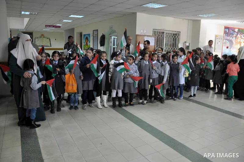 Palestinian students take part a protest against the Israeli blockade on the Gaza Strip, at al-Rantisi hospital, in Gaza city, on Nov. 26, 2013. Gaza has been almost entirely without fuel for weeks, and the resulting shu...