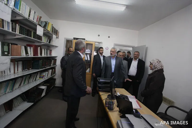 Palestinian Prime Minister in Gaza strip Ismail Haniyeh, visits the Fatwa and Legislation's office, in Gaza City on November 26, 2013. Photo by Ashraf Amra