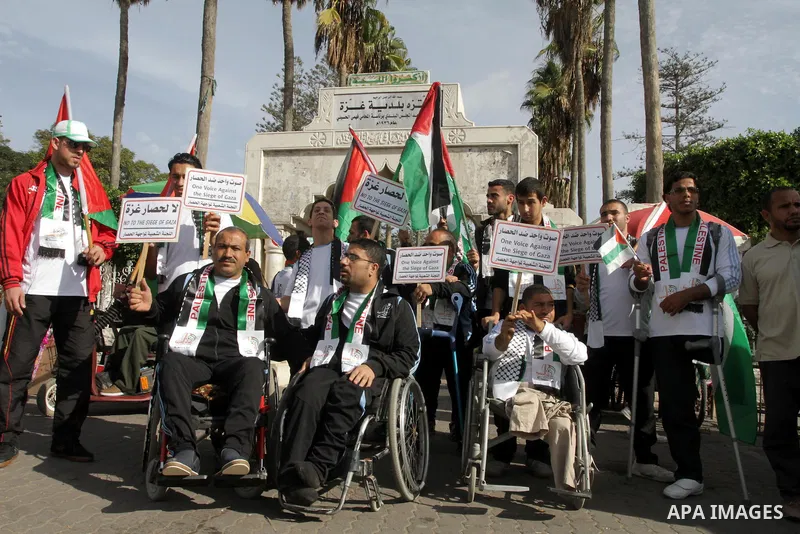Palestinians disabled take part in a protest against the Israeli blockade on Gaza strip, in Gaza city on November 27, 2013. Israel imposed a blockade on Gaza in 2007 after Islamist group Hamas seized control of the terri...