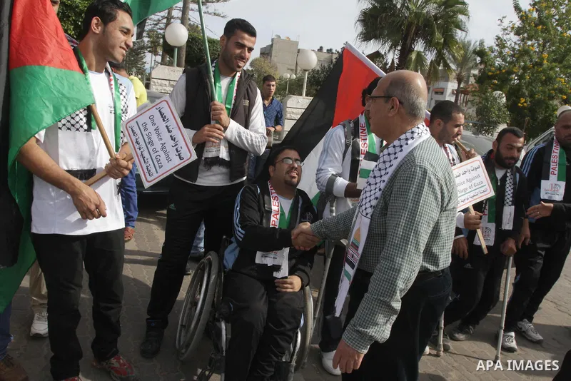 Palestinians disabled take part in a protest against the Israeli blockade on Gaza strip, in Gaza city on November 27, 2013. Israel imposed a blockade on Gaza in 2007 after Islamist group Hamas seized control of the terri...