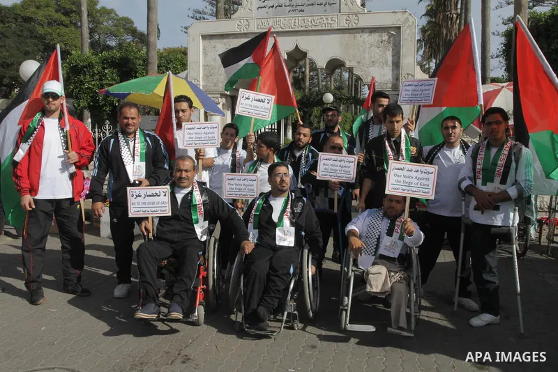 Palestinians disabled take part in a protest against the Israeli blockade on Gaza strip, in Gaza city on November 27, 2013. Israel imposed a blockade on Gaza in 2007 after Islamist group Hamas seized control of the terri...