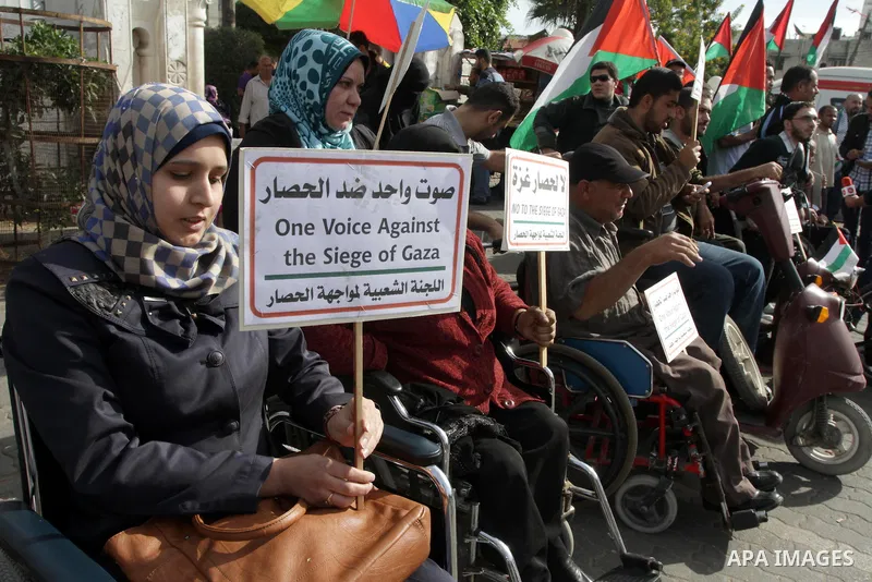 Palestinians disabled take part in a protest against the Israeli blockade on Gaza strip, in Gaza city on November 27, 2013. Israel imposed a blockade on Gaza in 2007 after Islamist group Hamas seized control of the terri...
