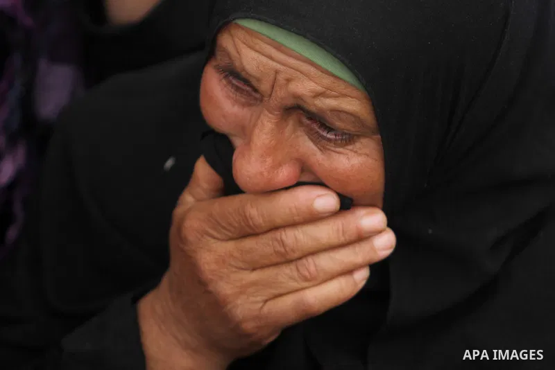 Relatives of Palestinian militants Mahmoud al-Najjar, and Moses Makhamreh during their funeral, on November 27, 2013 in the West Bank village of Yatta, one day after they were shot dead, along with another Palestinian ac...