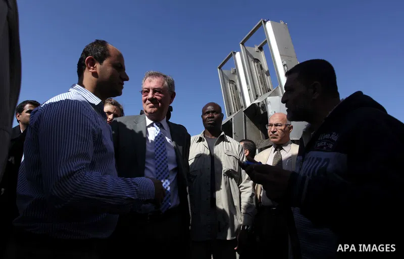 The United Nations Special envoy for the Middle East Robert H. Serry, inspects sanitation after a sewerage pipe in the Zeitoun neighborhood flooded, after the pumps stopped due to lack of fuel and electricity, in Gaza Ci...