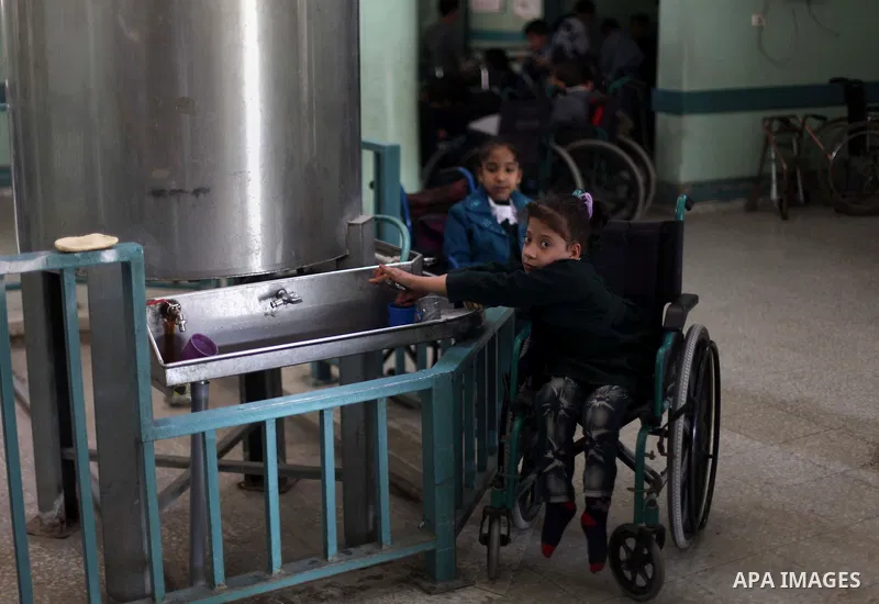Palestinian disabled children take part in a class at a school of rehabilitation in Gaza City on November 27, 2013. The school founded since 1993 aims to provide educational services, therapeutic, psychological and leisu...