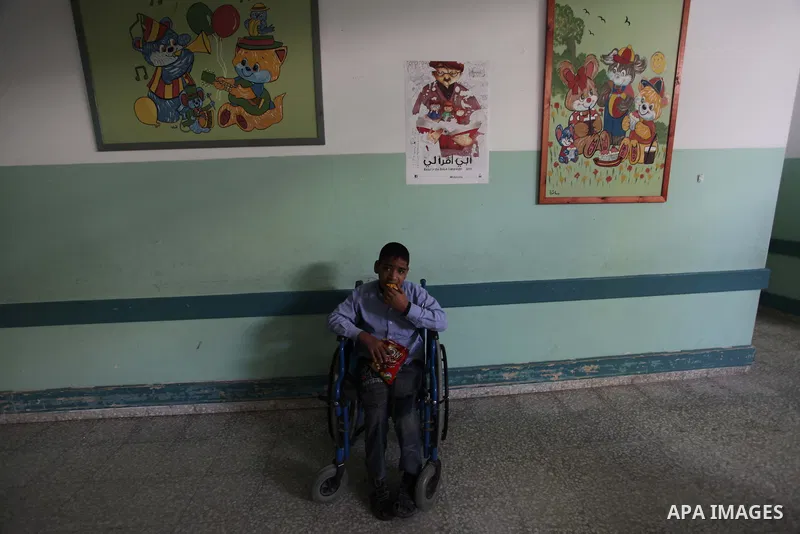 Palestinian disabled children take part in a class at a school of rehabilitation in Gaza City on November 27, 2013. The school founded since 1993 aims to provide educational services, therapeutic, psychological and leisu...