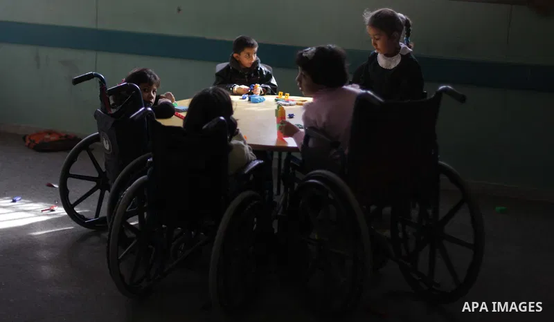 Palestinian disabled children take part in a class at a school of rehabilitation in Gaza City on November 27, 2013. The school founded since 1993 aims to provide educational services, therapeutic, psychological and leisu...