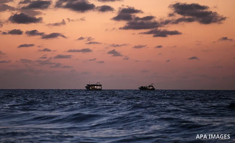 Palestinian fishermen ride their fishing boats in the sea in Gaza City on 28, 2013. The UN started distributing fuel in Gaza to maintain operations of critical facilities amid fears of a health crisis due to gathering ga...