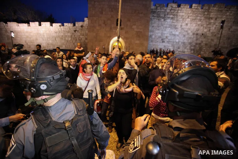Palestinian Protestors confront Israeli border policemen during a demonstration showing solidarity with Bedouin Arabs who are against an Israeli government displacement plan for Bedouins in the southern Negev desert, in...
