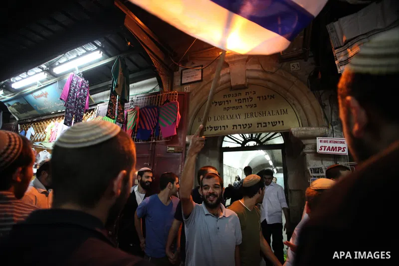 Ultra-Orthodox Jews light the fifth Hanukkah candle during the Jewish holiday of Hanukkah in Jerusalem's Mea Shearim neighbourhood, on Dec. 3, 2013. Hanukkah, also known as the Festival of Lights, is one of the most impo...