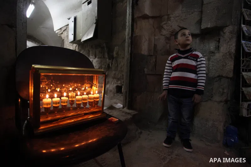 Ultra-Orthodox Jews light the fifth Hanukkah candle during the Jewish holiday of Hanukkah in Jerusalem's Mea Shearim neighbourhood, on Dec. 3, 2013. Hanukkah, also known as the Festival of Lights, is one of the most impo...