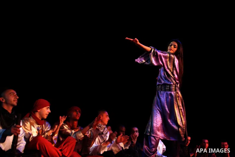 Palestinian youths participate in dancing of "Dabka" at Al-Hakawati Stage in the Old City of Jerusalem on Dec. 07, 2013. Photo by Saeed Qaq