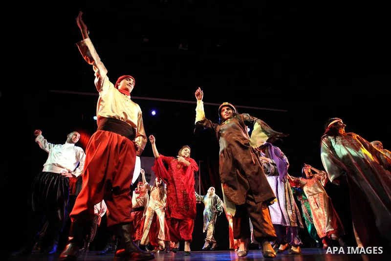 Palestinian youths participate in dancing of "Dabka" at Al-Hakawati Stage in the Old City of Jerusalem on Dec. 07, 2013. Photo by Saeed Qaq