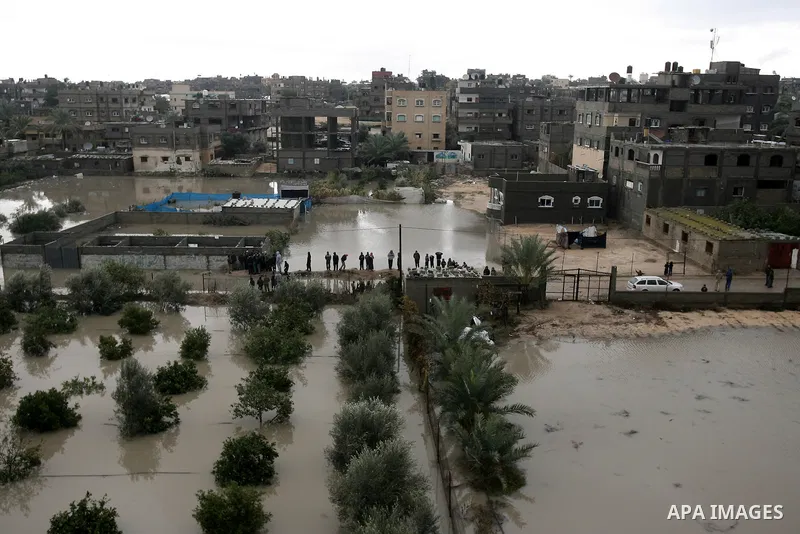 A general view shows flooded streets following heavy rains on a stormy day in Rafah, in the southern Gaza Strip, December 12, 2013. Streets in Gaza Strip are flooded after only three hours of heavy rain which causes seve...