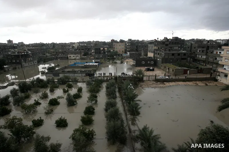 A general view shows flooded streets following heavy rains on a stormy day in Rafah, in the southern Gaza Strip, December 12, 2013. Streets in Gaza Strip are flooded after only three hours of heavy rain which causes seve...