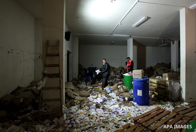 Palestinians try to save medicines at a drugstore after being flooded during four days of storms in Beit Hanoun, in the northern Gaza Strip, December 16, 2013. The results of winter storm Alexa in Gaza will lead to a hea...