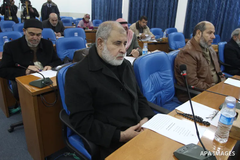 Members of the Palestinian Legislative Council, attend the meeting at the Legislative Council, in Gaza City on Dec. 18, 2013. Photo by Mohammed Asad