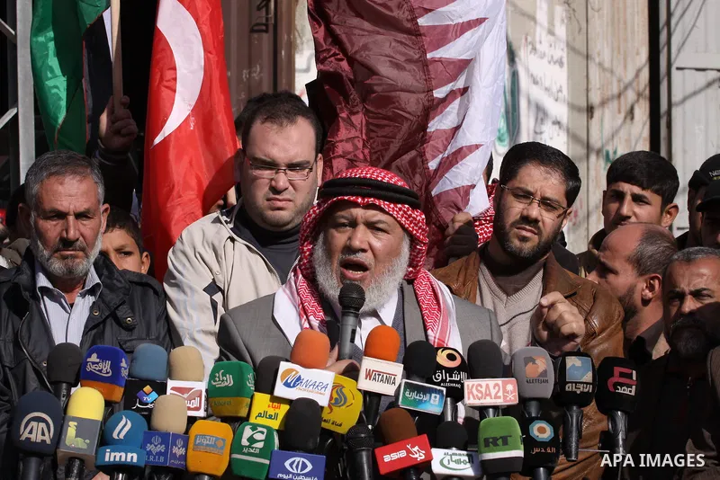 Palestinian deputy of the Legislative Council Marwan Abu Ras speaks during a press conference in Gaza City on, 21, Dec. 2013. Rescue workers evacuated thousands of Gaza Strip residents from homes flooded by heavy rain, u...