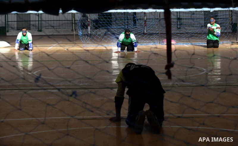 Palestinian blind goalball players compete during the goalball championship league, organised by Palestinian Federation of goalball, in Gaza City on Dec. 23, 2013. Photo by Ashraf Amra