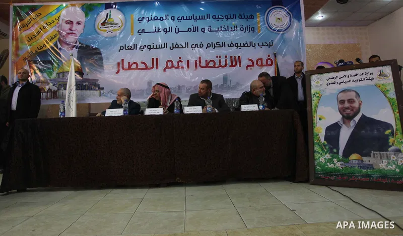 Palestinian officials of the Interior Ministry and National Security participate in a ceremony of the annual general "The victory regiment although the blockade", in Gaza City, on Dec. 24, 2013. Photo by Ashraf Amra