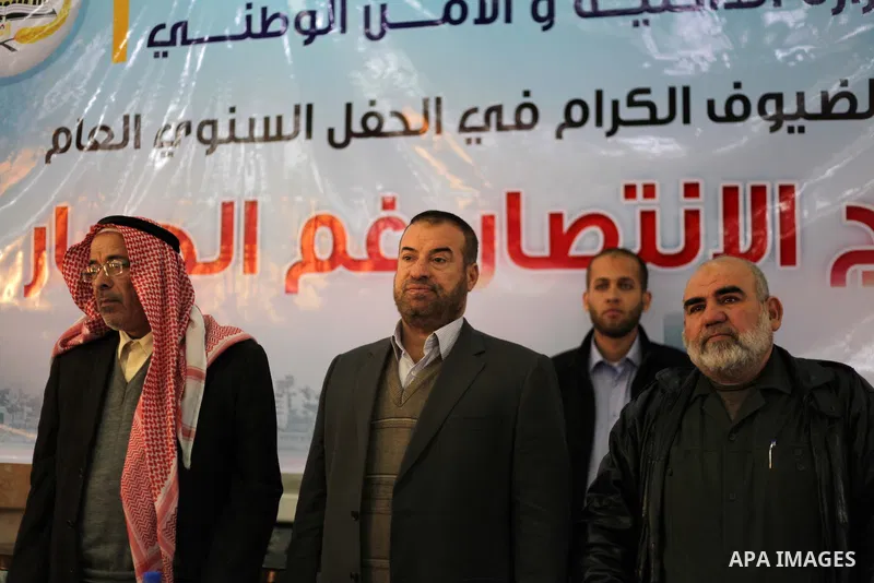 Palestinian officials of the Interior Ministry and National Security participate in a ceremony of the annual general "The victory regiment although the blockade", in Gaza City, on Dec. 24, 2013. Photo by Ashraf Amra