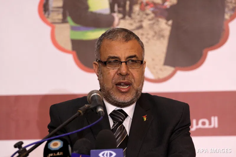 Palestinian Health Minister Mufid al-Mukhalalati, speaks during the signing ceremony of contracts of Qatari projects, in Gaza on Dec. 24, 2013. Photo by Mohammed Asad