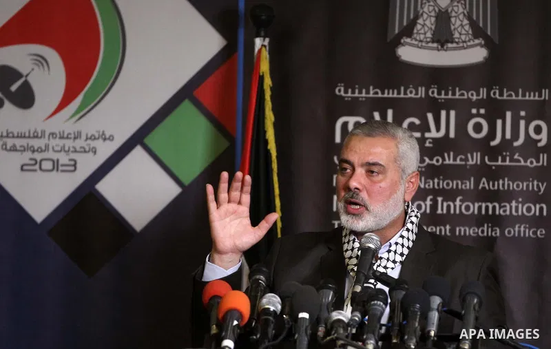 Palestinian Prime Minister in Gaza Strip Ismail Haniyeh speaks during a press conference, in Gaza City on Dec. 31, 2013. Photo by Ramadan Alagha