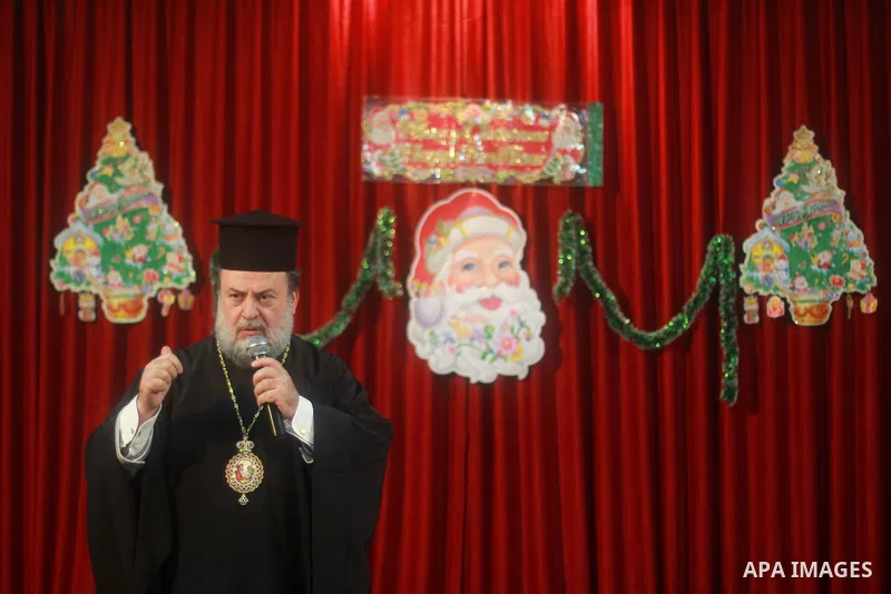 Palestinian christians take part in the celebration of the New Year at the Church of Saint Porphyrius, in Gaza City, December 31, 2013. Photo by Hosam Salem