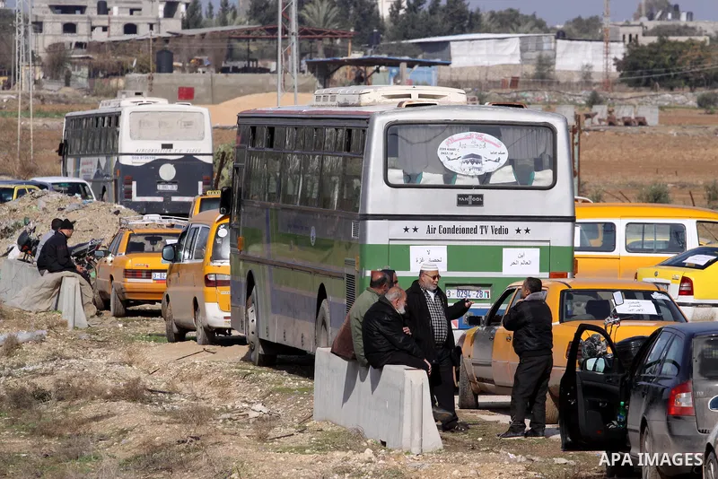 Palestinian taxi drivers stop their cars during a protest to solve the crisis of fuel, in front of the Karni crossing in the eastern Gaza city, on Jan. 01, 2014. Photo by Mohammed Asad