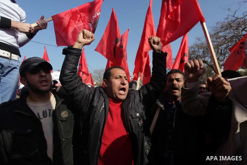 Palestinian supporters of "Democratic front for the liberation of Palestine" shout slogans during a protest against renewed peace talks between Israelis and Palestinians on January 2, 2014 in Gaza City. Israel and the Pa...