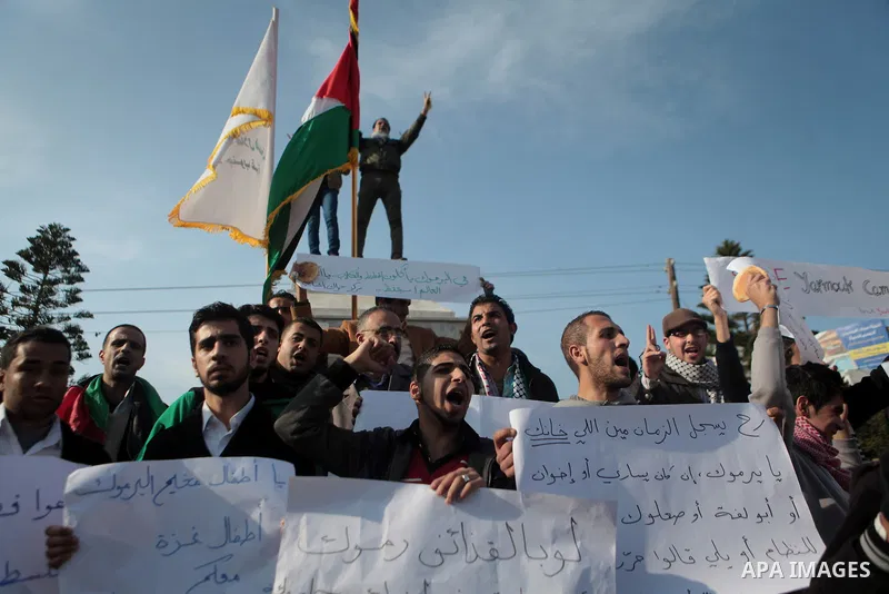 Palestinians take part in a protest in solidarity with Palestinian children at Yarmouk refugee camp in Syria on January 4, 2014 in Gaza city. The Syrian army has besieged the Yarmouk Palestinian camp for a year as battle...
